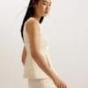 AKENI Pleated Peplum Top